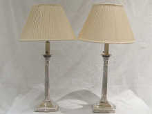 A pair of silver plated tall