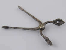 A pair of silver sugar tongs by