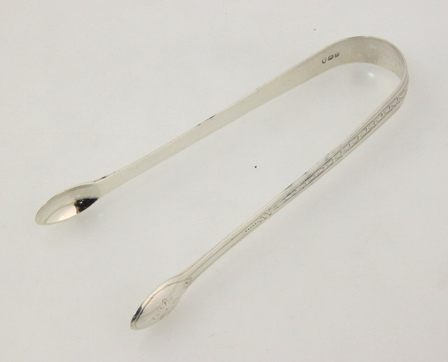 A pair of silver sugar nips