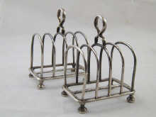A pair of silver toast racks