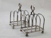 A pair of silver toast racks r