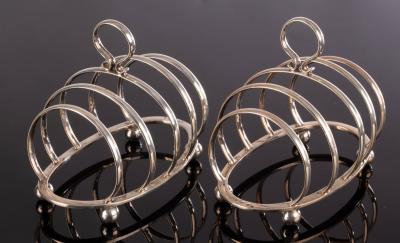 A pair of silver toast racks,