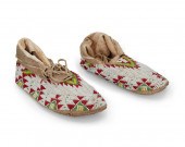A PAIR OF SIOUX BEADED HIDE MO
