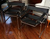 A PAIR OF SLING CHAIRS AFTER T