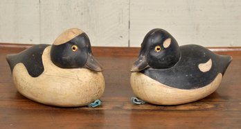A pair of small size vintage carved