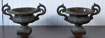 A pair of small vintage cast iron