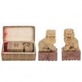 A PAIR OF SOAPSTONE FOO DOGS &