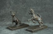 A PAIR OF SOLID CAST BRONZE TE