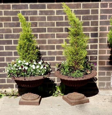 A pair of squat cast iron campana