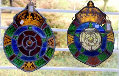 A pair of stained-glass roundels,