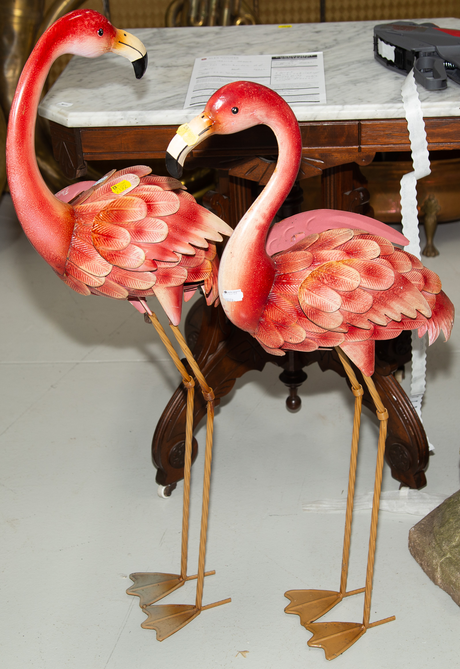 A PAIR OF TIN PINK FLAMINGOES 34