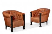 A PAIR OF TUFTED LEATHER LIBRA