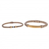A PAIR OF TWISTED CABLE BRACEL