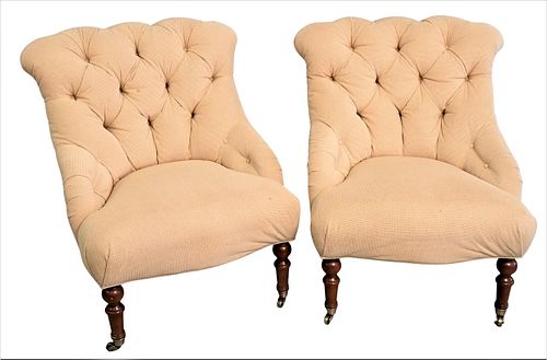 A PAIR OF UPHOLSTERED SLIPPER