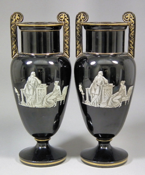 A pair of Victorian black glass two