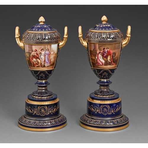 A pair of Vienna style vases,