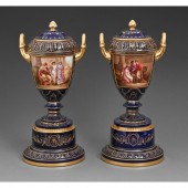 A pair of Vienna style vases,