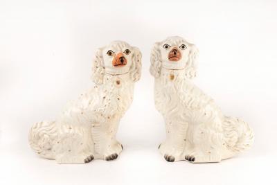 A pair of white glazed