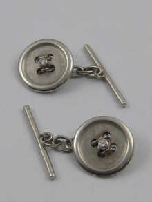 A pair of white metal (tests