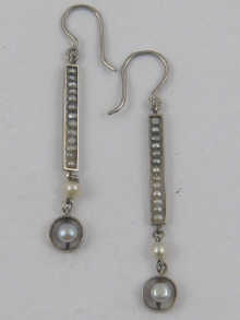 A pair of white metal (tests 18