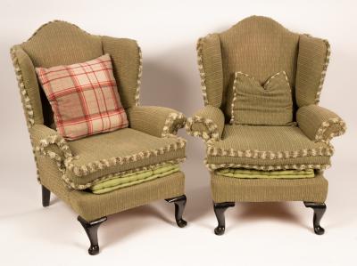 A pair of wingback armchairs on