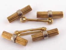 A pair of yellow and white metal