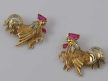 A pair of yellow and white metal
