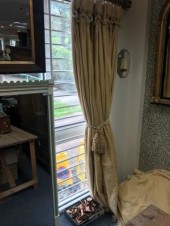 A pair of yellow damask curtai