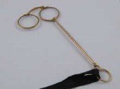 A pair of yellow metal (tests