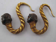 A pair of yellow metal (tests