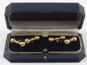 A pair of yellow metal (tests
