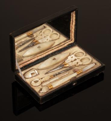 A Palais Royal sewing set contained