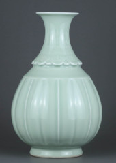 A PALE CELADON-GLAZED CARVED '