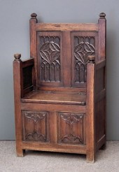 A panelled oak ''Monk's'' benc