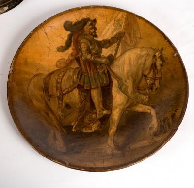 A papier-mâché charger decorated