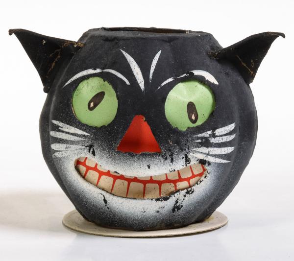 A PAPIER MACHE JACK-O-LANTERN CANDY
