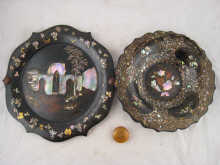 A papier mache swing handled dish