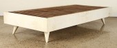 A PARCHMENT COVERED DAY BED CI