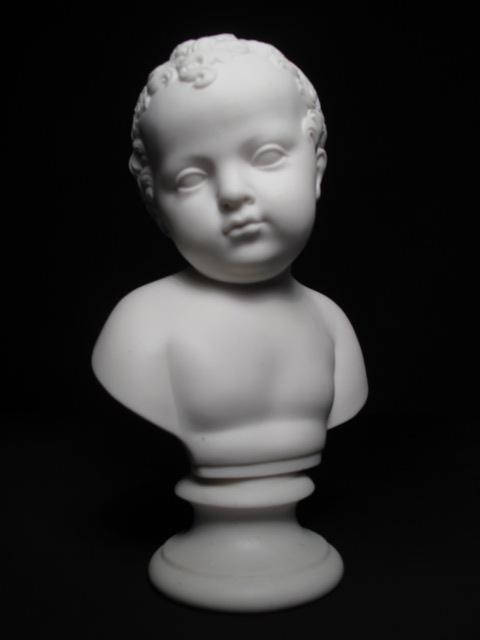 A Parian porcelain bust of a child.