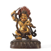 A PARTLY GILT BRONZE FIGURE OF