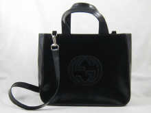 A patent leather Gucci shoulder bag