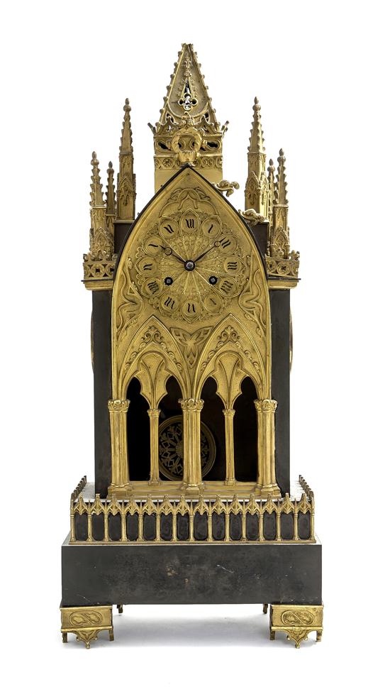 *A Patinated and Gilt Bronze Mantel