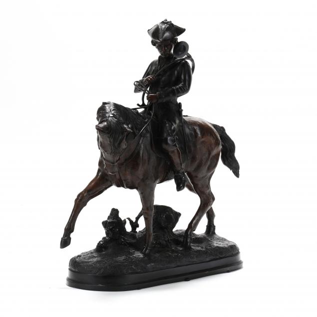 A PATINATED BRONZE FIGURE OF