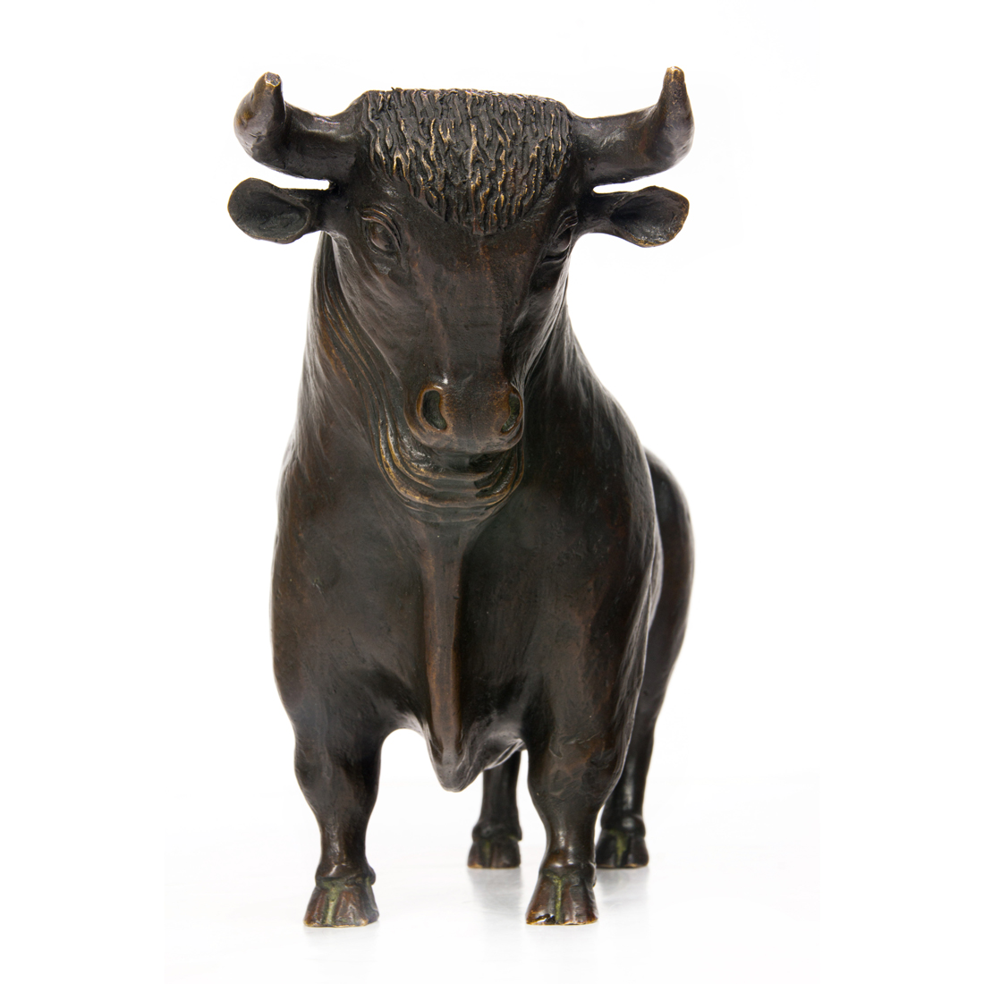A PATINATED BRONZE FIGURE OF A BULL
