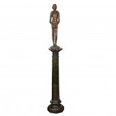 A PATINATED BRONZE FIGURE OF J