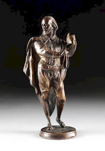 A PATINATED BRONZE SCULPTURE OF