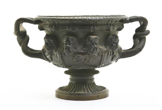 A Patinated Bronze Urn having
