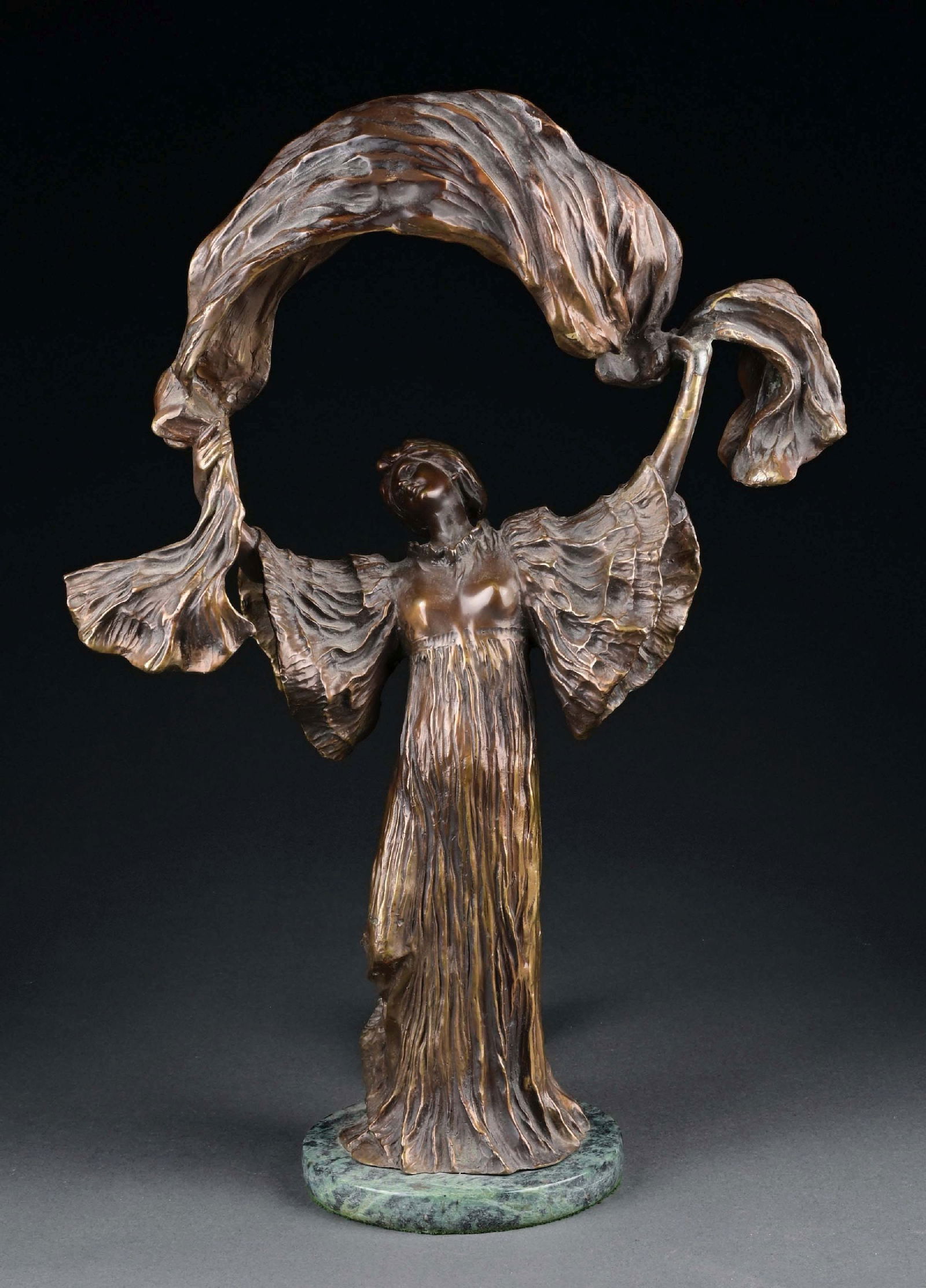A PATINATED METAL AND BRONZE LAMP
