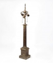 A PATINATED METAL COLUMNAR LAM