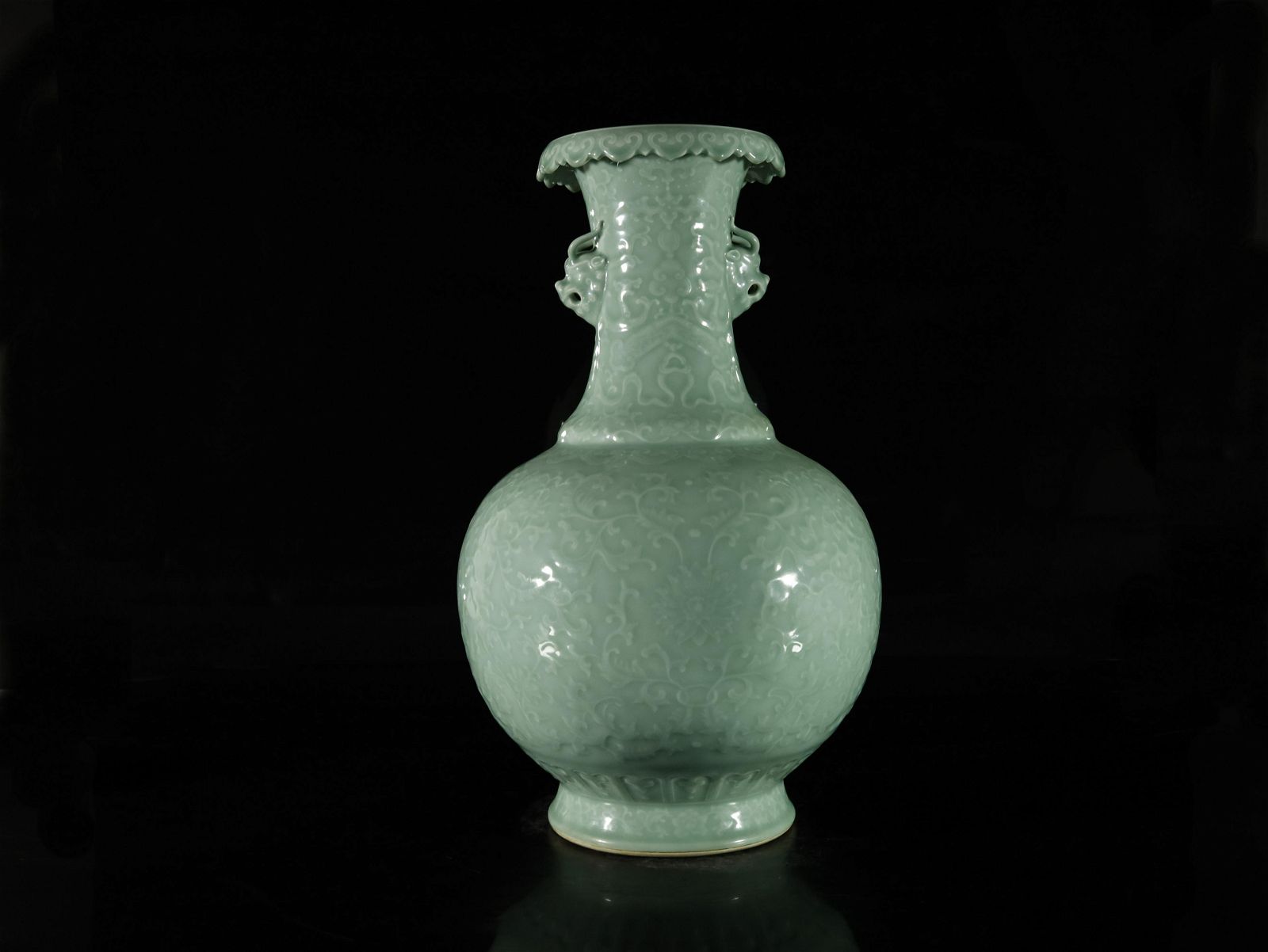 A PEA-GREEN GLAZED 'FLOWER' VASEA